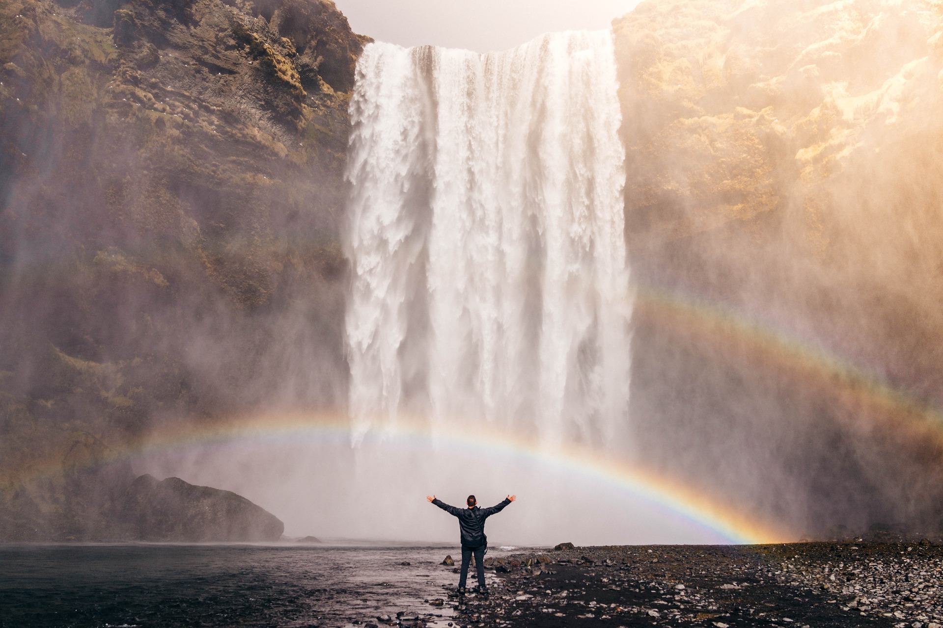 waterfall w man n rainbow